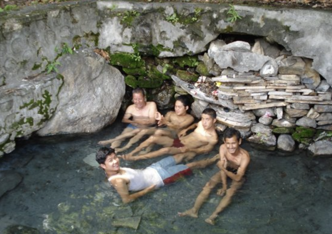people are bath in hot water in borong
